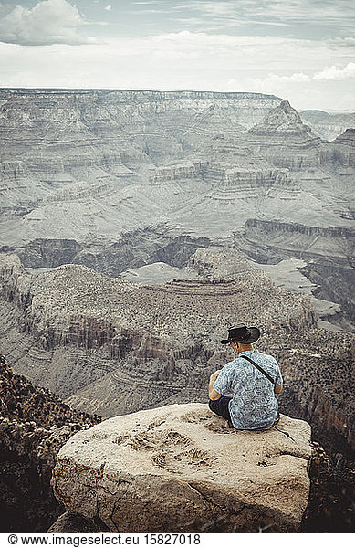 Man Observe Colorado River from Grand Canyon point