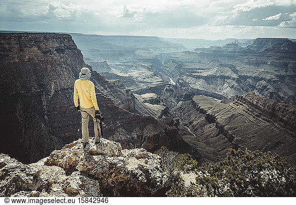 man observe Colorado river from Grand Canyon village view