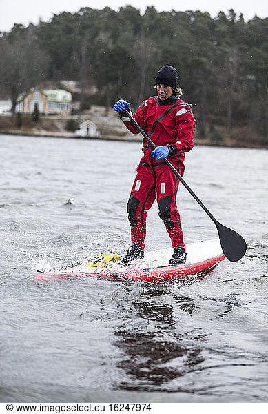 Man paddle boarding