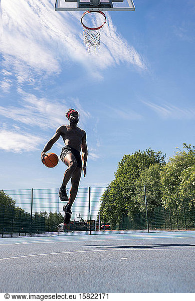Man playing basketball  dunking