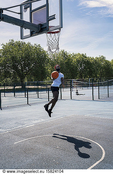Man playing basketball  dunking
