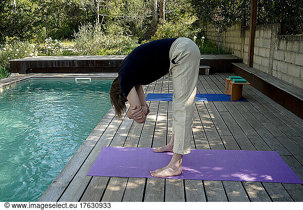 Man practicing Yoga outdoors.