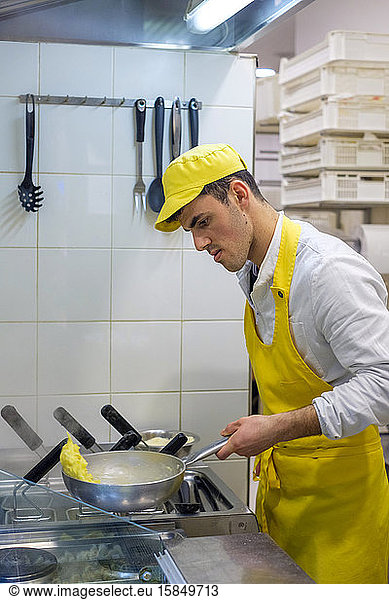 Man preparing fresh pasta at Mercato di San Lorenzo  Florence  Tuscany  Italy