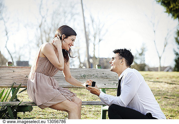 Man proposing to girlfriend at park