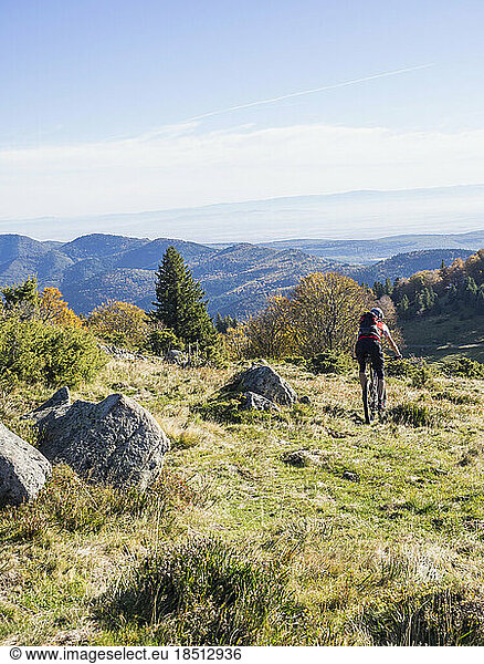 Man riding electric mountain bike on cycling tour in the Vosges  France