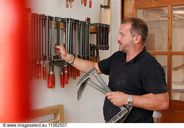 Man selecting hand tool