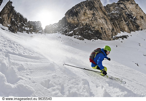 Man skiing downhill