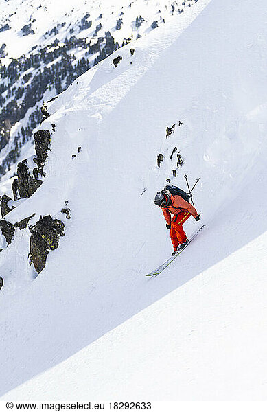 Man skiing downhill on Pyrenees mountain  Catalonia  Spain