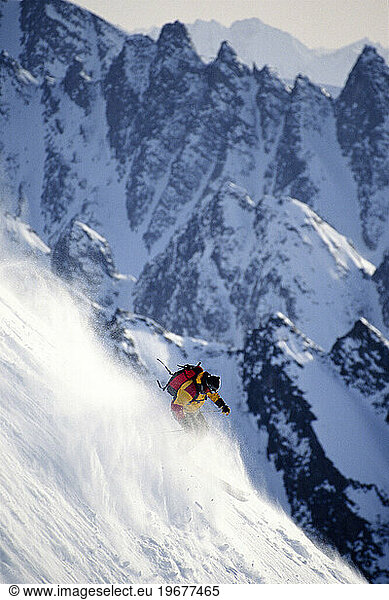 man skiing in rugged terrain  Alaska