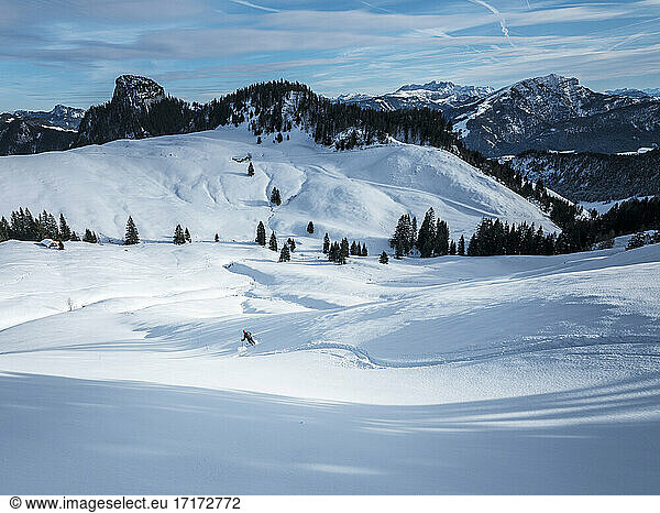 Man skiing on snow covered Karkopf  Lattengeburge  Berchtesgadenerland  Germany