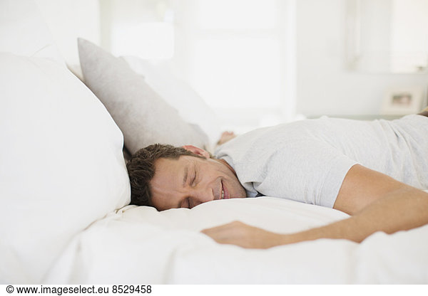 Man sleeping on bed