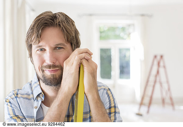 Man smiling in living space