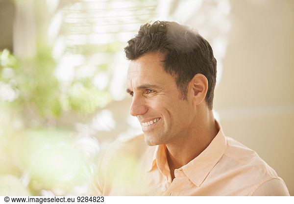 Man smiling indoors