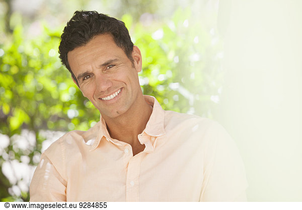 Man smiling outdoors