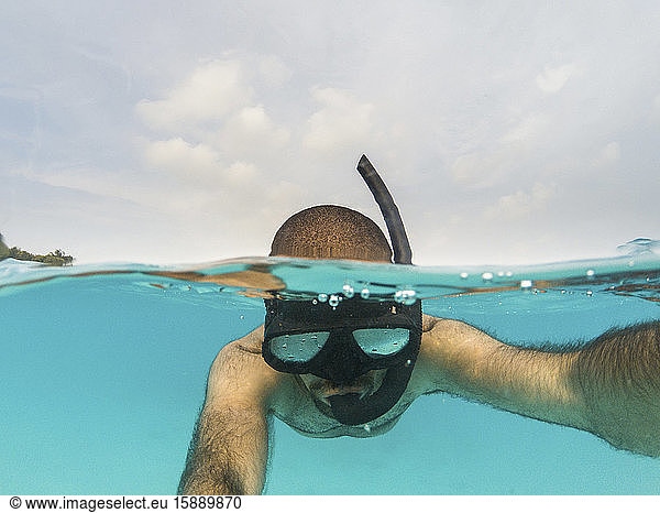 Man snorkeling on the water surface