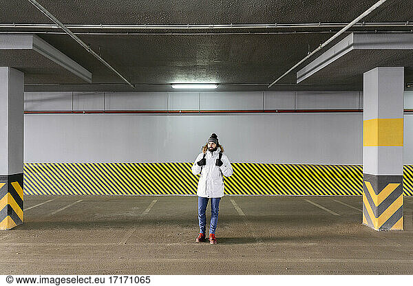 Man standing in parking garage