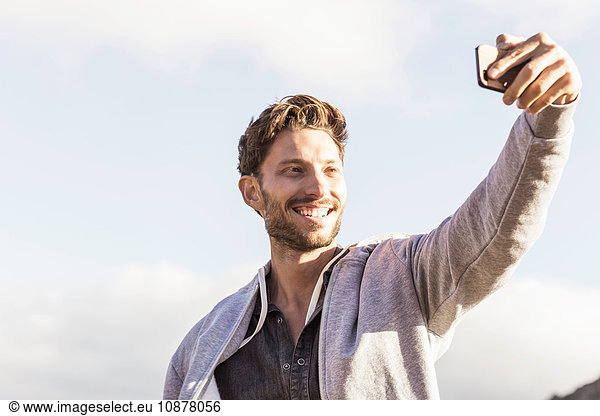 Man taking selfie smiling
