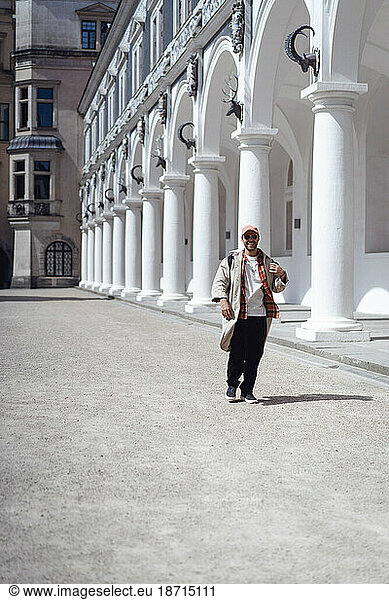 Man tourist in the Stallhof stable yard in Dresden.