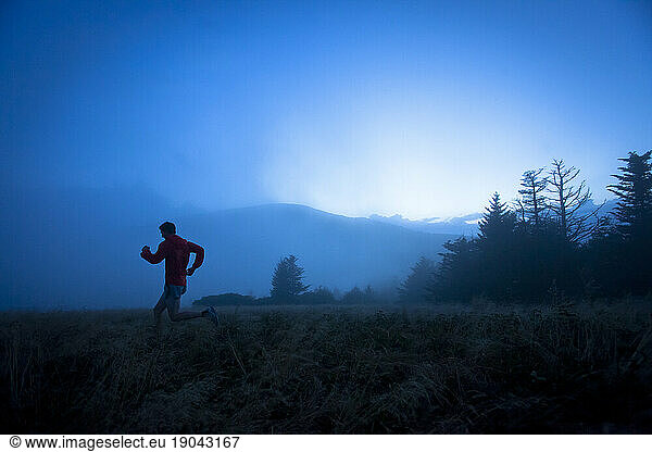 Man trail runs at Roan Mountain  TN. (foggy)
