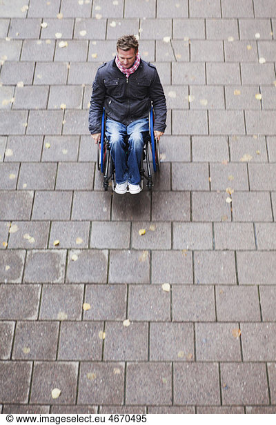 Man travelling in wheelchair