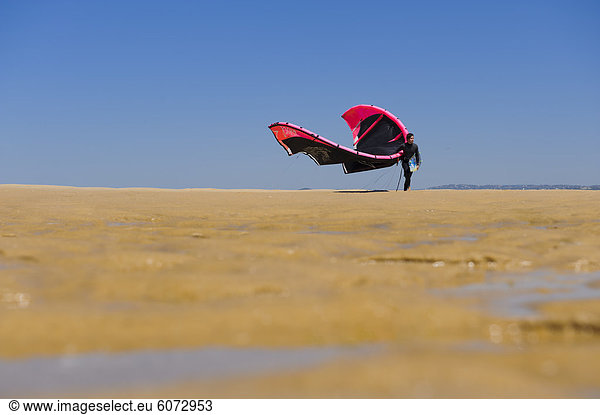 Man walking with parachute