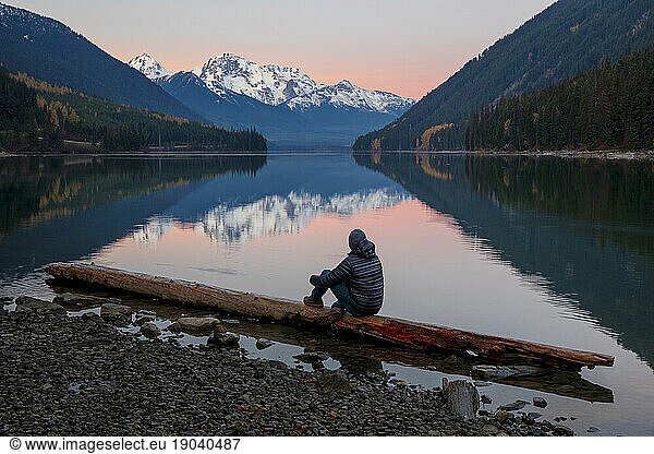 Man watching sunset atÃ?Â DuffeyÃ?Â Lake  Duffey Lake Provincial Park  British Columbia  Canada