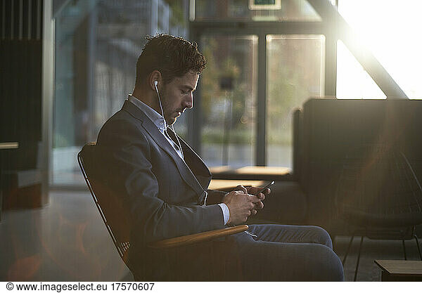 Man wearing a suit waiting for his job interview