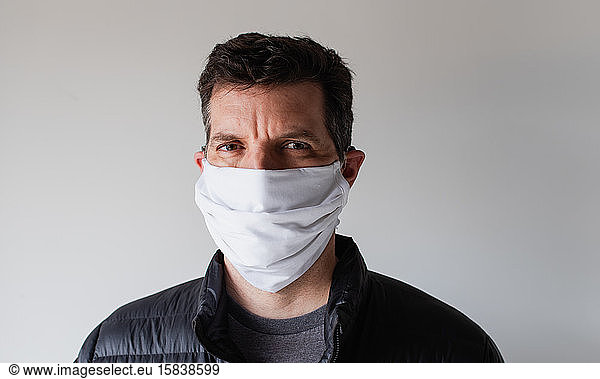 Man wearing homemade cloth face mask during Covid 19 pandemic.