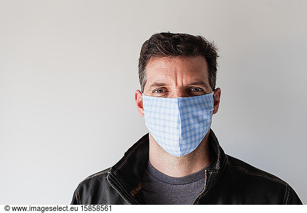 Man wearing homemade cloth face mask during Covid 19 pandemic.