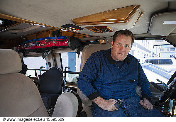 Man with a spinal cord injury exiting his accessible van