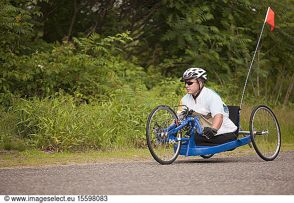 Man with disability participating in a handcycle race