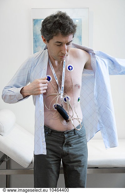 MAN WITH ECG HOLTER