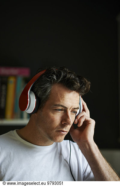 Man with headphones on listening