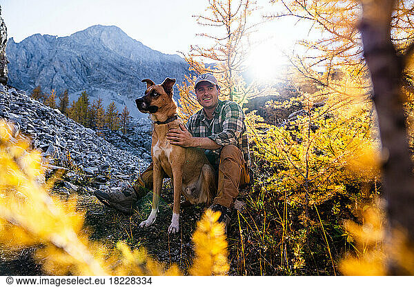 Man With His Best Friend On Sunset Hike