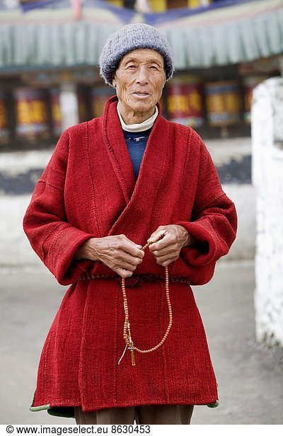 Man with prayer beads. Tawang Monastery  Arunachal Pradesh  India.