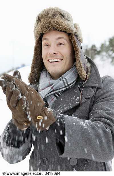 Man with snowy gloves