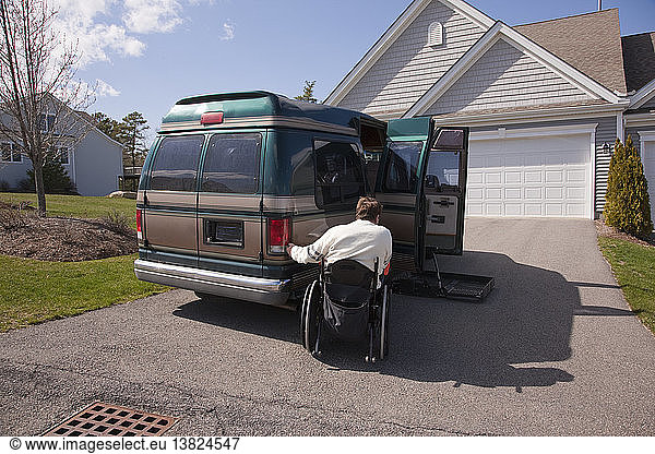 Man with spinal cord injury using magnetized remote to open his accessible vehicle