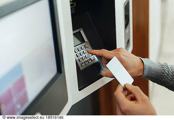 Man withdrawing cash from ATM machine