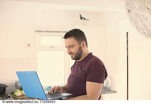 Man working from home at laptop