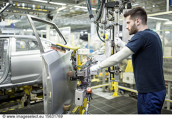 Man working in modern car factory