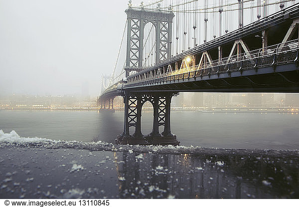 Manhattan Bridge over East River during winter