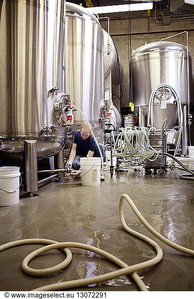Manual worker working in brewery