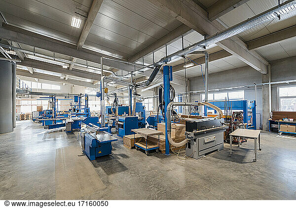 Manufacturing machinery in production hall at industry
