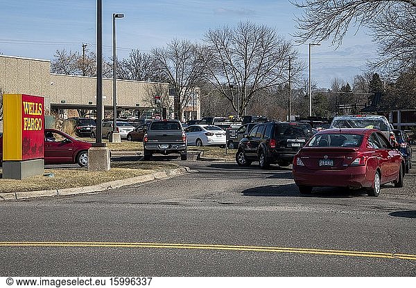 Maplewood  Minnesota. When the governor announced to be sheltered in people rush to the bank to draw out money causing a huge backup and long lines.
