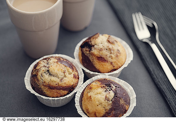 Marble muffins on dark table