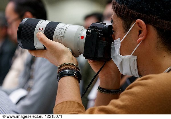 March 3  2018  Yokohama  Japan - A man tries out the new cameras Sony a7 III at the CP+ Camera & Photo Imaging Show 2018 in Pacifico Yokohama. Japan's largest camera and photo imaging exhibition bring together 1 123 exhibitor booths during the four-day trade show at the Pacifico Yokohama and OSANBASHI Hall. Organizers expect approximately 70 000 visitors until March 4th.
