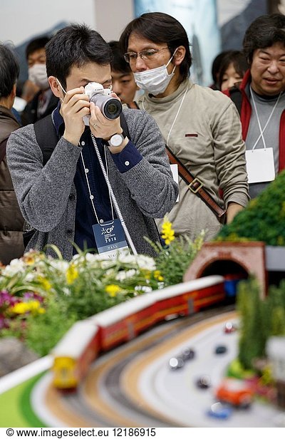 March 3  2018  Yokohama  Japan - A man tries out the new Canon camera EOS Kiss M at the CP+ Camera & Photo Imaging Show 2018 in Pacifico Yokohama. Japan's largest camera and photo imaging exhibition bring together 1 123 exhibitor booths during the four-day trade show at the Pacifico Yokohama and OSANBASHI Hall. Organizers expect approximately 70 000 visitors until March 4th.