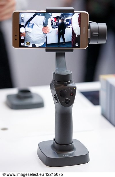 March 3  2018  Yokohama  Japan - The new DJI OSMO MOBILE 2 on display at the CP+ Camera & Photo Imaging Show 2018 in Pacifico Yokohama. Japan's largest camera and photo imaging exhibition bring together 1 123 exhibitor booths during the four-day trade show at the Pacifico Yokohama and OSANBASHI Hall. Organizers expect approximately 70 000 visitors until March 4th.