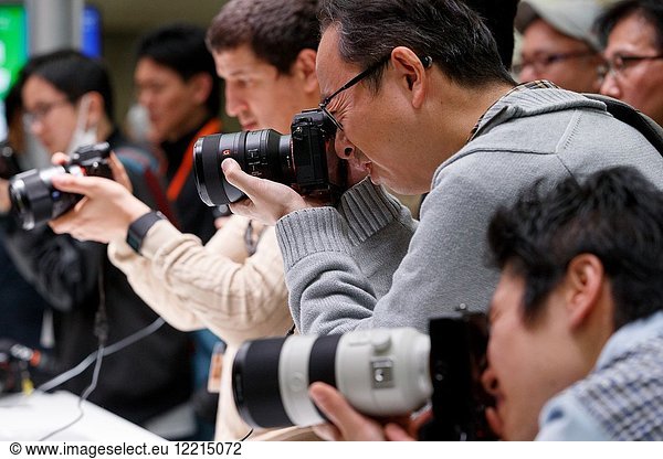 March 3  2018  Yokohama  Japan - Visitors try out the new cameras Sony a7 III at the CP+ Camera & Photo Imaging Show 2018 in Pacifico Yokohama. Japan's largest camera and photo imaging exhibition bring together 1 123 exhibitor booths during the four-day trade show at the Pacifico Yokohama and OSANBASHI Hall. Organizers expect approximately 70 000 visitors until March 4th.