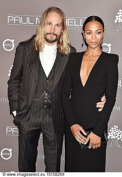 Marco Perego (L) and Zoe Saldana arrive at the The 2018 Baby2Baby Gala Presented By Paul Mitchell Event at 3LABS on November 10  2018 in Culver City  California.